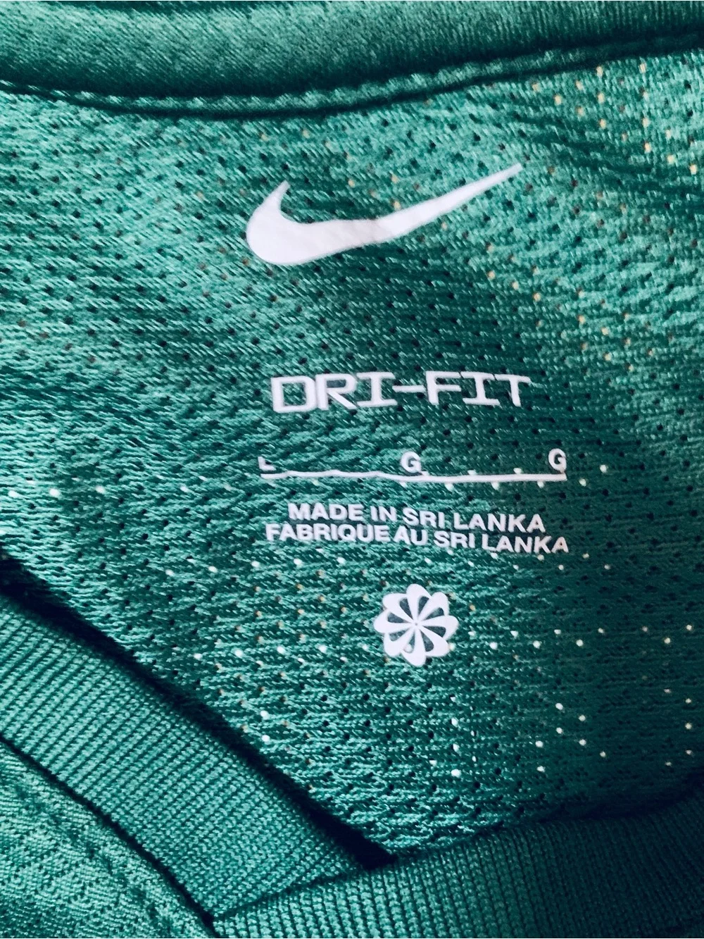 2 Nike Boys L Shirts : Defy Gravity' Nike tee and a green Milltown United jersey